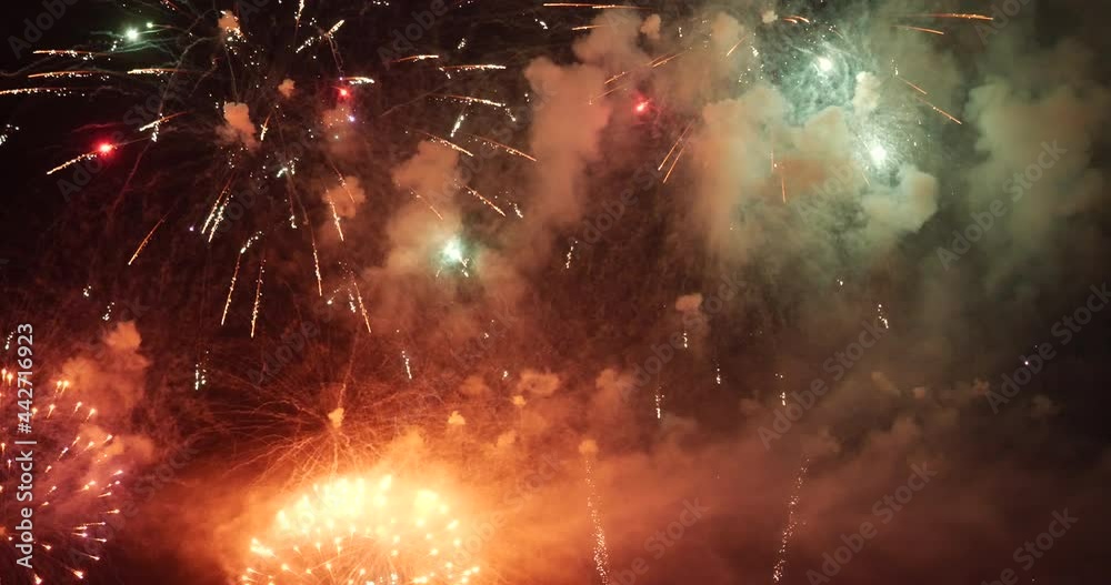 Colorful vibrant Firework celebrate anniversary happy new year 2022, 4th of july holiday festival. colorful firework in the night time to celebrate national holiday. countdown new year 2022 party time