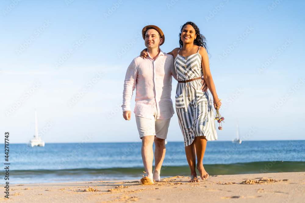 Young couple enjoying time together on the beach Young couple enjoying time together on the beach