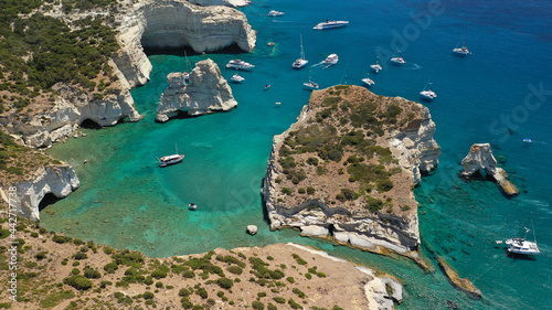 Arial drone photo of Kleftiko a beautiful scenic white volcanic rock formation bay visited by sail boats and yachts with turquoise crystal clear sea and caves, Sea Meteora of Greece, Milos island