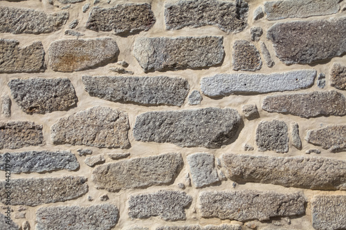 Architecture textures, detailed and rustic of paired masonry granite, traditional spanish granite wall