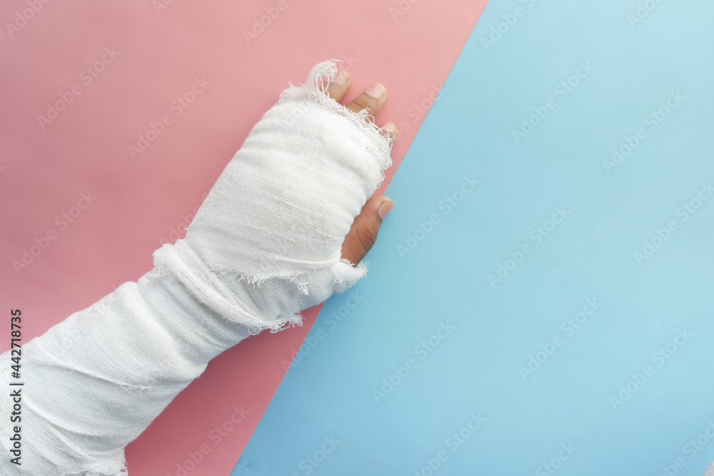 injured painful hand with bandage 