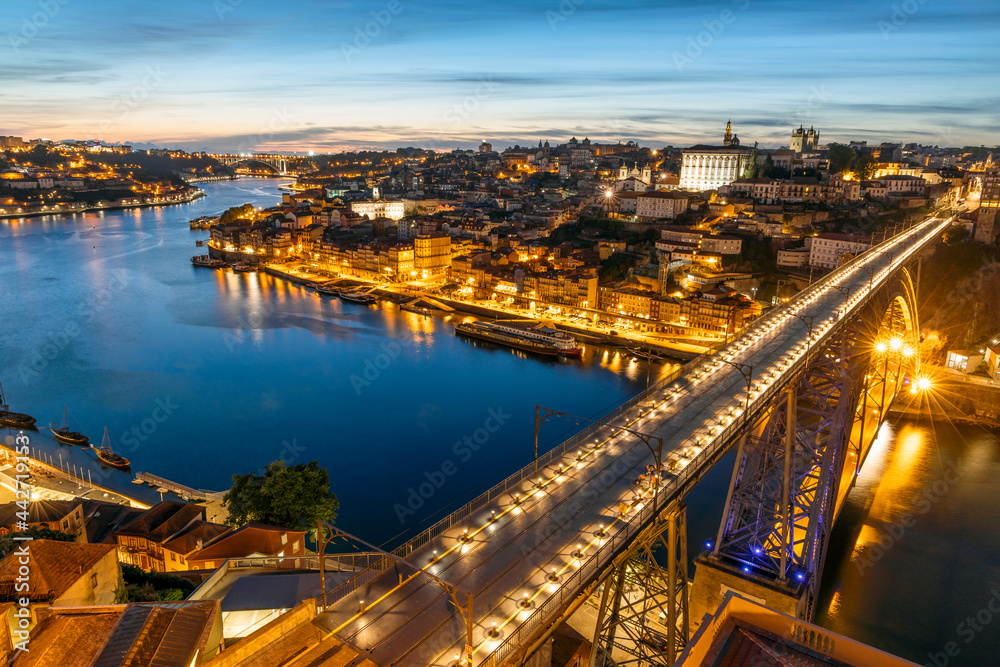 Skyline of the historic city of Porto with famous bridge at night, Portugal