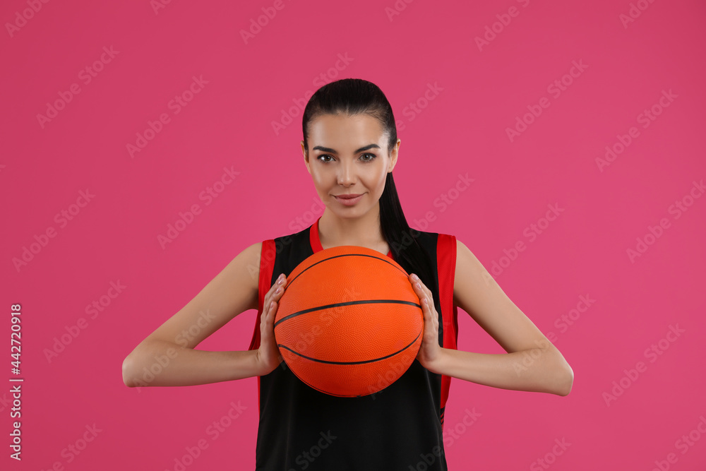 Basketball player with ball on pink background Basketball player with ball on pink background