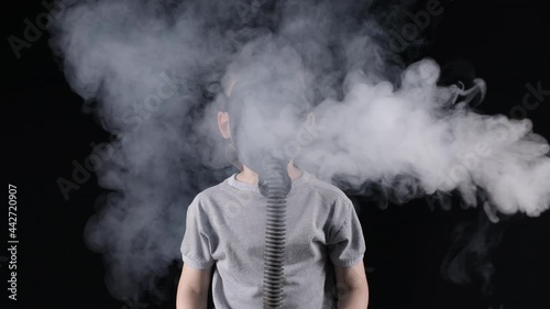 Video of five-year-old boy in gas mask on black