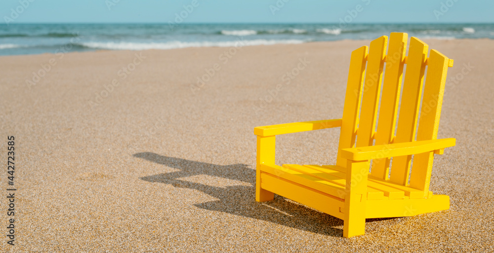 yellow chair on the beach, web banner yellow chair on the beach, web banner