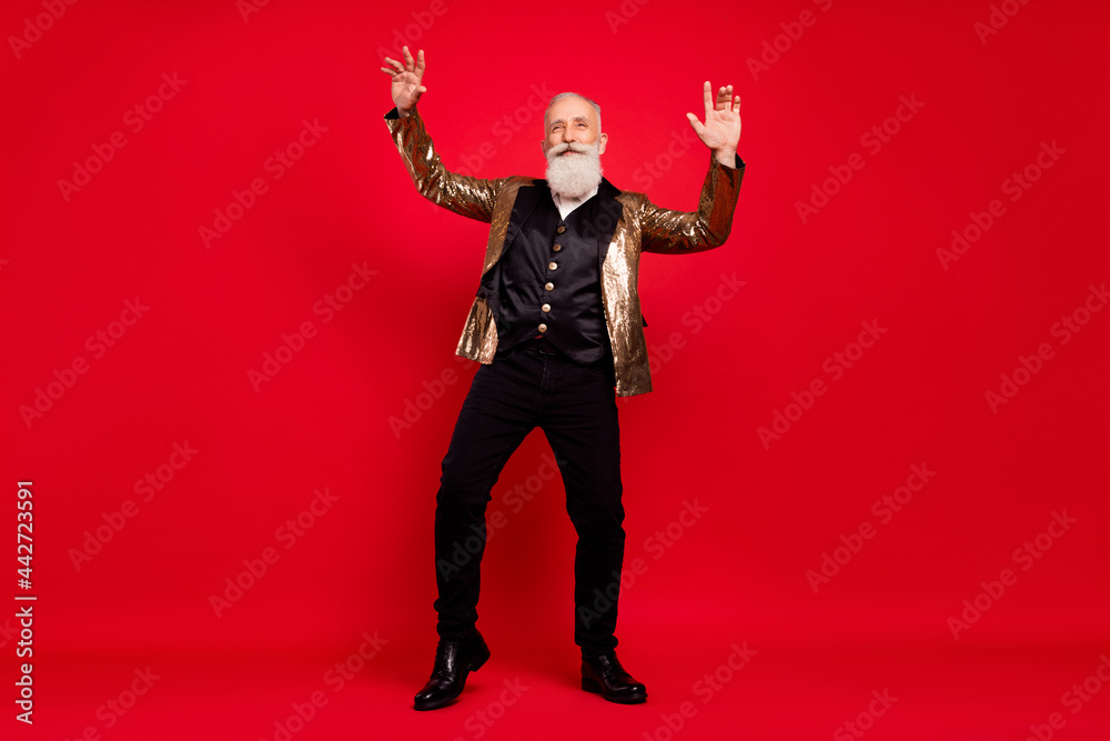 Fototapeta premium Full length body size view of attractive cheerful grey-haired man dancing having fun isolated over bright red color background