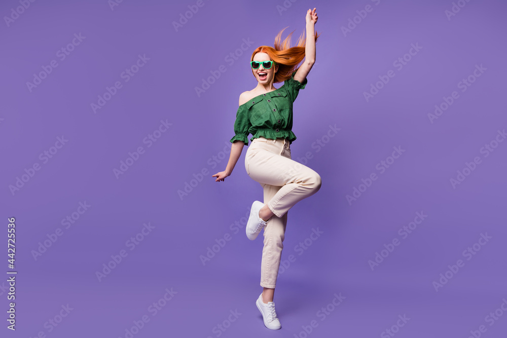 Photo of pretty funny young woman dressed off-shoulders blouse dark eyewear dancing smiling isolated violet color background