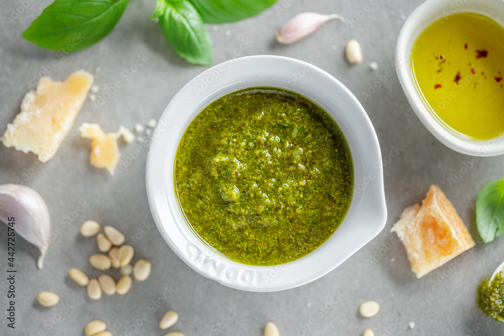 Pesto sauce in small bowl on table Pesto sauce in small bowl on table