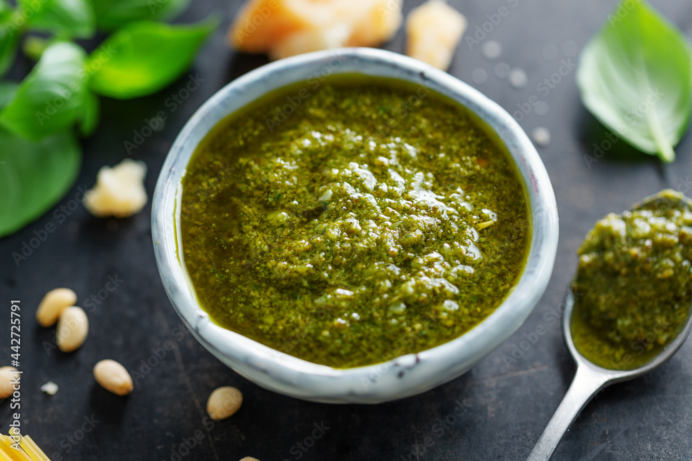 Pesto sauce in small bowl on table Pesto sauce in small bowl on table