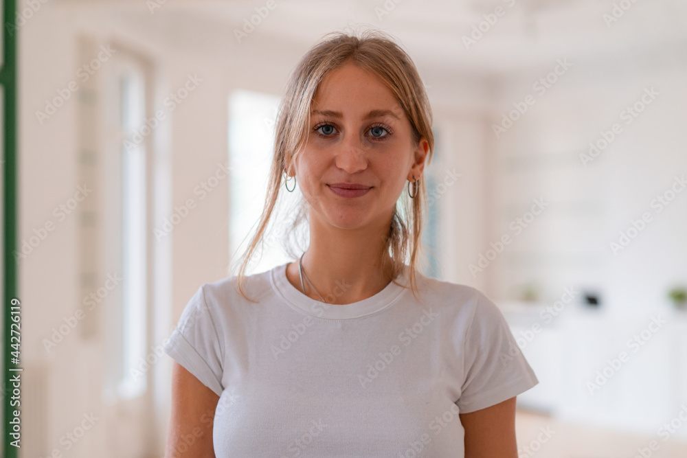 Smiling woman looking at camera at home Smiling woman looking at camera at home