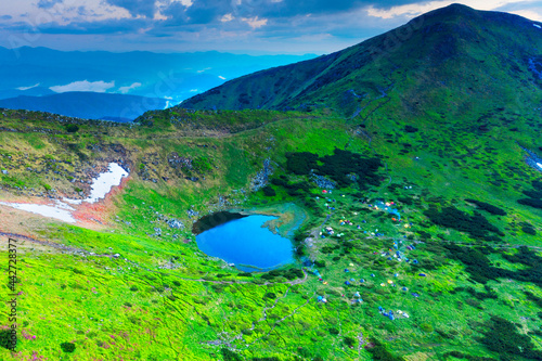 Tents near the mountain lake Nesamovyte photo