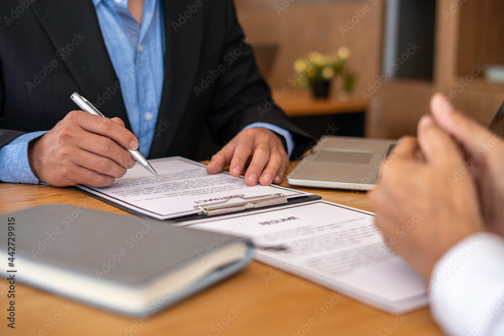 Human resources manager conducting job interview with applicant in the office, Candidate with resume at the job interview with human resource, Recruitment Human resources manager conducting job interview with applicant in the office, Candidate with resume at the job interview with human resource, Recruitment