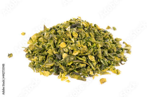 Dried green paprika flakes with seeds isolated on white background. Chopped jalapeno, habanero or chilli pepper. Spices and herbs.