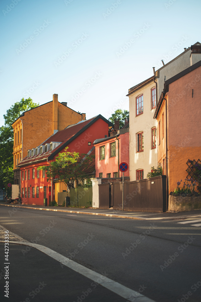 Old beautiful houses in the old town of Oslo, Norway. Colorful architecture on a sunny summer day.