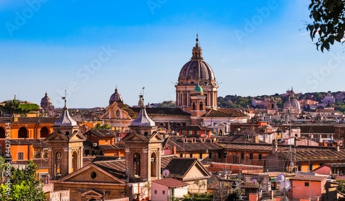 The houses's roofs and domes of churches in eternal Rome from a height