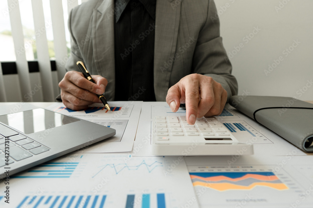 Businessman working in finance and accounting Analyze financial budget in the office. Businessman working in finance and accounting Analyze financial budget in the office.