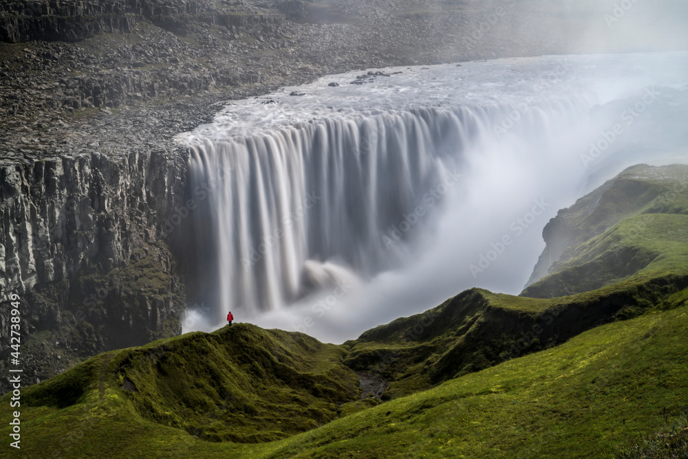Fototapeta premium Person Staring over Dettifoss Waterfall, Vatnajökull National Park, Iceland
