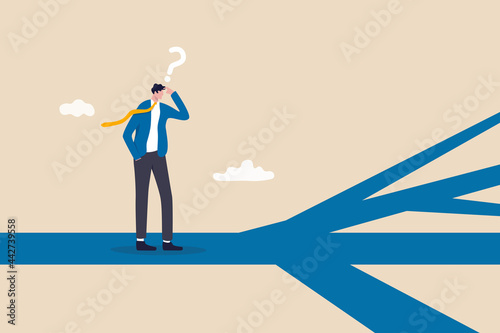 Business direction, choosing options or multiple path, make decision for career path or business growth, paradox of choice concept, confused businessman thinking make decision on multiple route ahead. photo