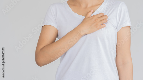 Wallpaper Mural Young woman with pain in the body and arms white background medical concept . Torontodigital.ca