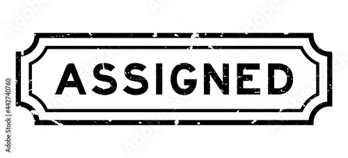 Grunge black assigned word rubber seal stamp on white background