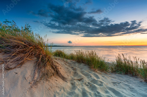 Fototapeta Naklejka Na Ścianę i Meble -  A beautiful sunset on the beach of the Sobieszewo Island at the Baltic Sea. Poland
