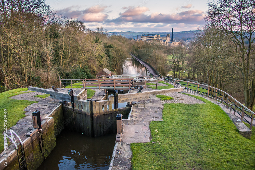 Fototapeta premium Five Rise Locks at the canal in Bingley in evening sunlight