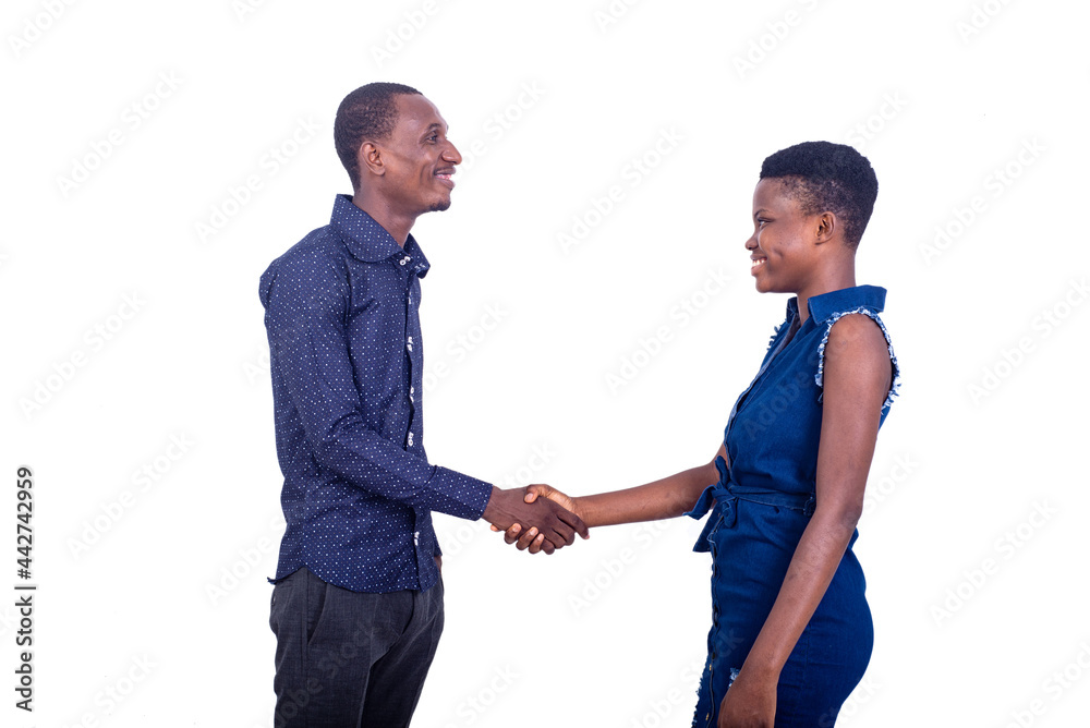 handsome young man and woman greeting each other while smiling.