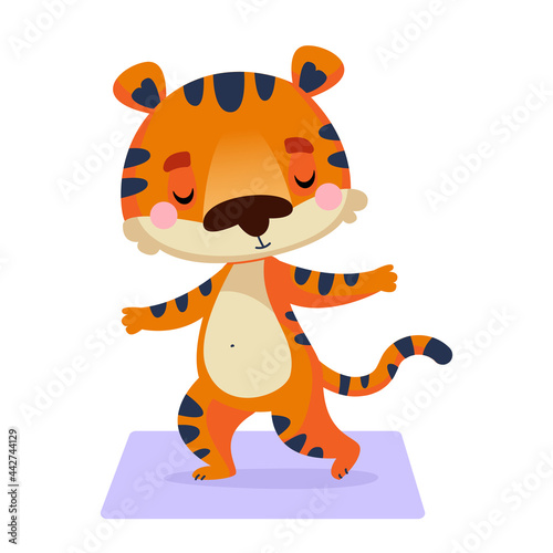 Fototapeta Naklejka Na Ścianę i Meble -  A tiger cub is standing on a mat in a yoga pose with closed eyes. Animal sports. Vector illustration in children s cartoon style. Isolated funny clipart on a white background. Nice print.