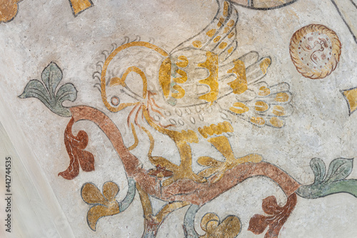 the mythological bird Phoenix feeding his nestlings with his own blod, an ancient mural photo