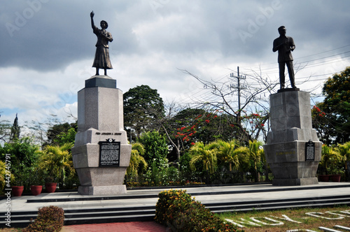 Ninoy and Cory Aquino statue Monument in Plaza Roma garden park for Filipino people and foreign travelers travel visit in Intramuros Square at Maynila city on April 17, 2015 in Manila, Philippines photo
