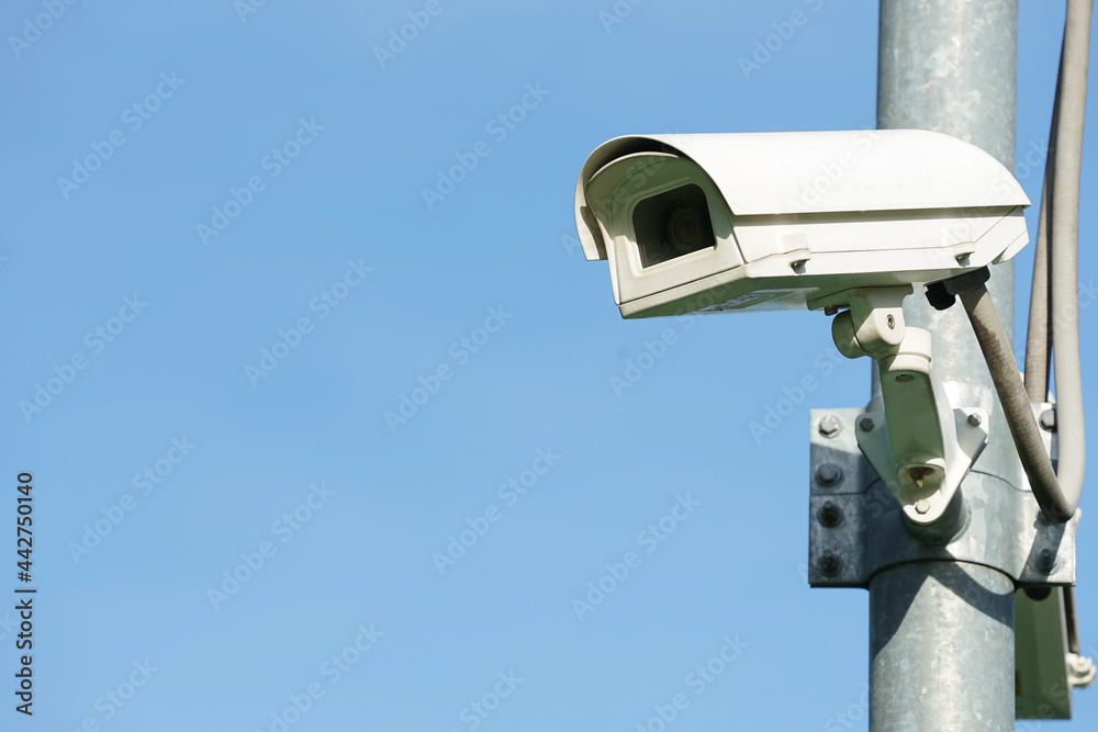 CCTV camera on pole background blue sky ,concept security in home, office,public, ect CCTV camera on pole background blue sky ,concept security in home, office,public, ect
