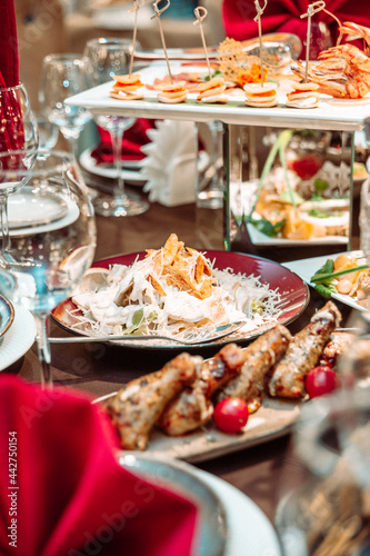 Caesar salad on the festive table in the cafe