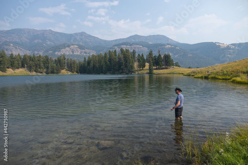Man fly-fishing at Trout Lake in Yellowstone National Park