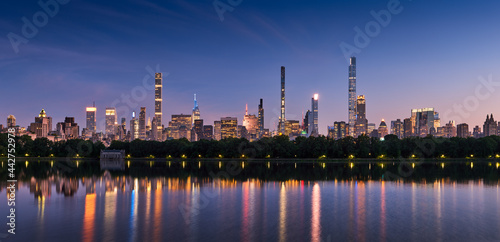 New York City skyline. Midtown Manhattan skyscrapers from Central Park Reservoir at Dusk. Evening view  of billionaires' row super tall luxury buildings photo