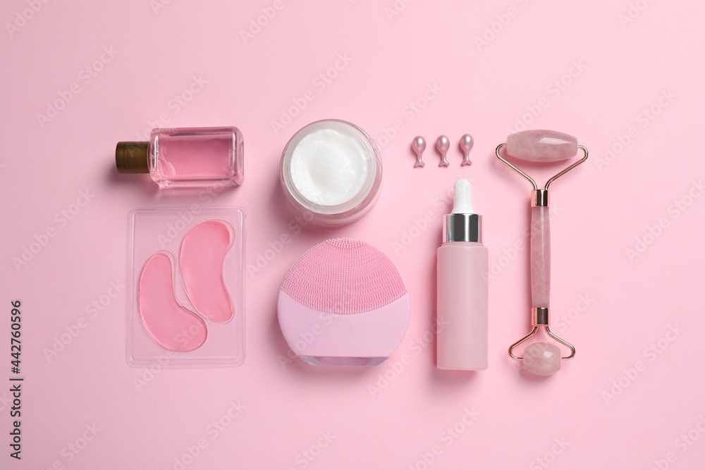 Flat lay composition with skin care products and accessories on pink background Flat lay composition with skin care products and accessories on pink background