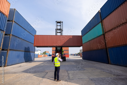 Bild auf Leinwand Container Supervisor Control forklift handing Import and Export While Inspecting
