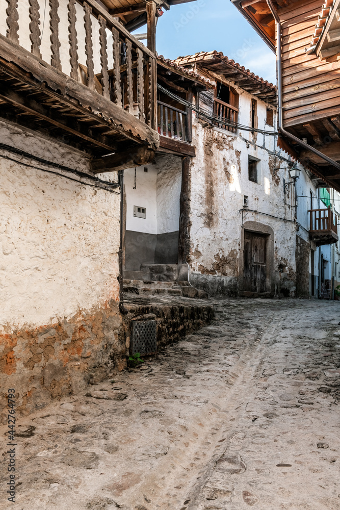 street in typical Spanish town with very old houses in the town of Valverde de la Vera in Caceres in Spain