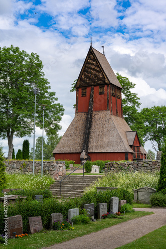 the historic old church in Gamla Uppsala with the cemetery in the foreground