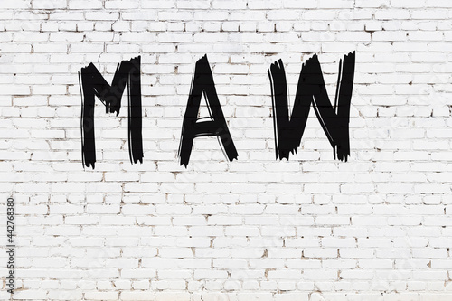 White wall with black paint inscription maw on it