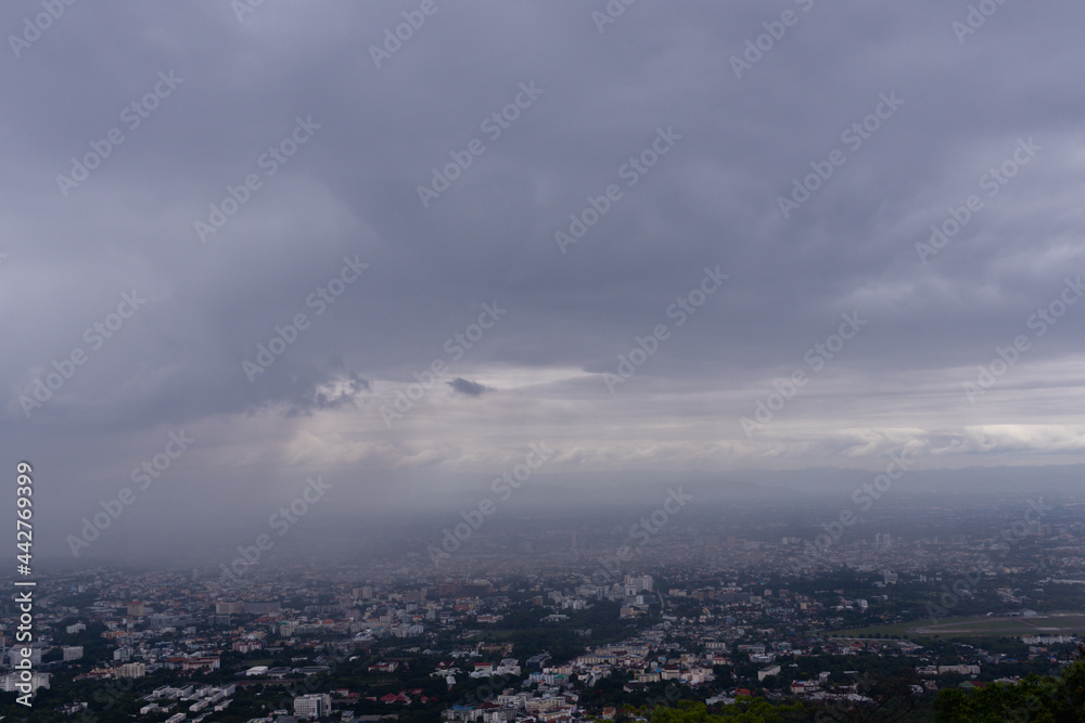 The view from the top of the mountain to see the beautiful scenery of Chiang Mai during the rainy season makes it possible to see the rain cloud and rain that are falling towards Chiang Mai city.
