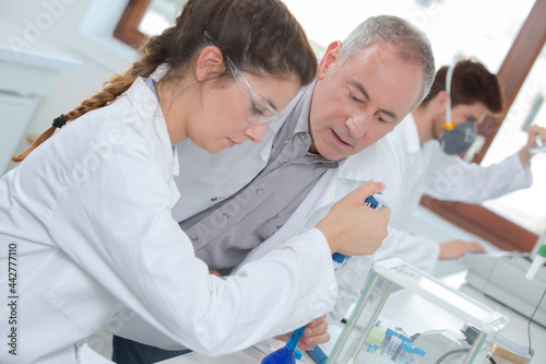 female scientist and teacher at a lab