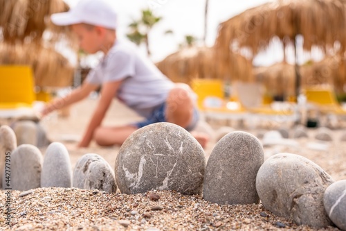 Child play sand summer ocean. childhood coast photo