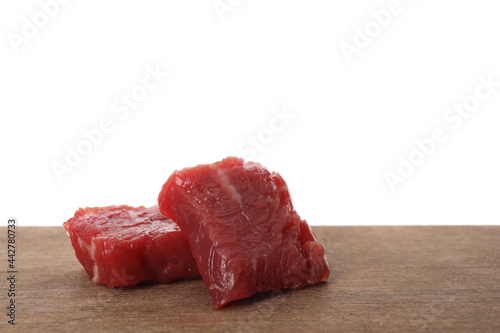 Vászonkép Pieces of raw cultured meat on wooden table against white background, space for