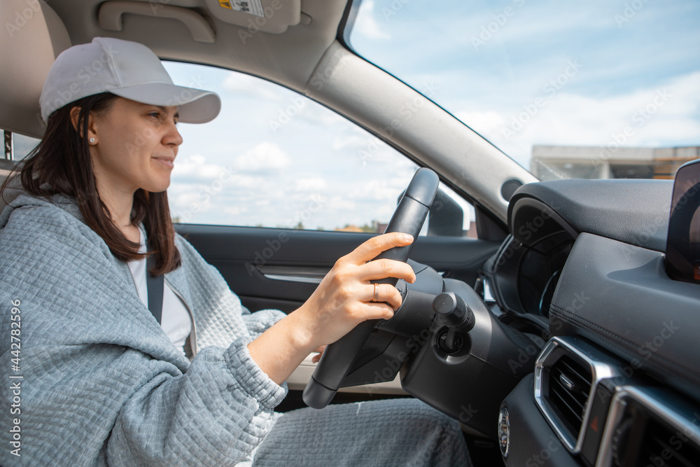 smiling woman driving car view from inside smiling woman driving car view from inside