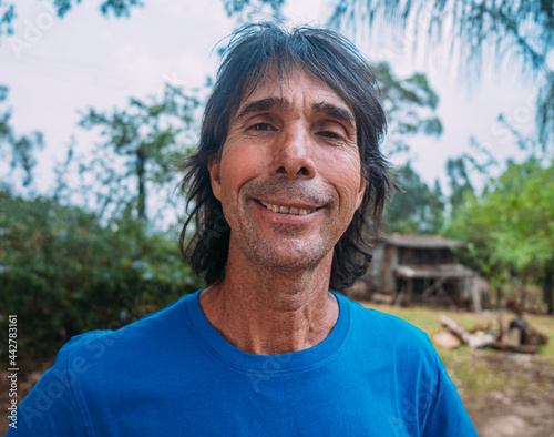 Latin man of indigenous descent on his farm. Brazilian farmer.