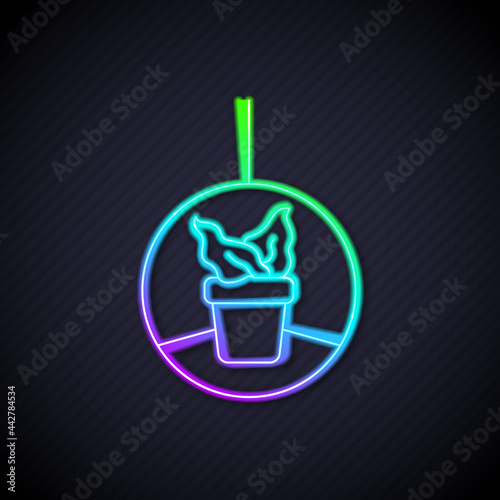 Glowing neon line Plant in hanging pot icon isolated on black background. Decorative macrame handmade hangers for flower pot, hang indoor plants. Vector