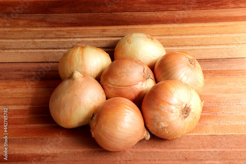 White onion on a wooden background. High Resolution Image