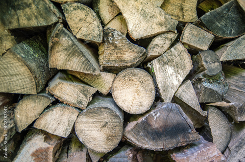 A pile of firewood. Preparation of firewood for the winter. Firewood background