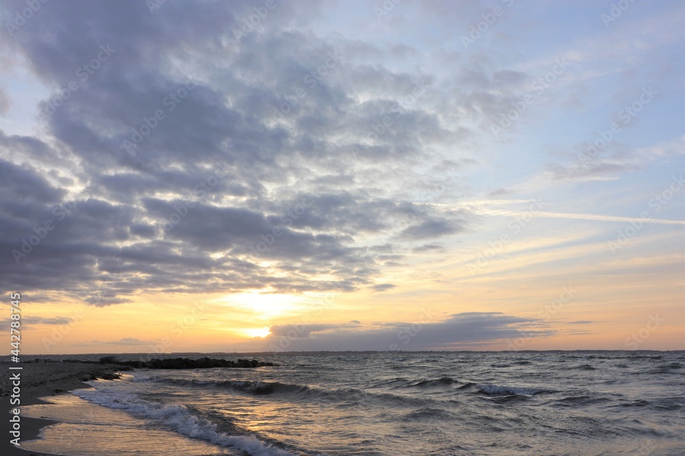 Scenic sea view with waves and colorful evening sky at dawn. Scenic sea view with waves and colorful evening sky at dawn.