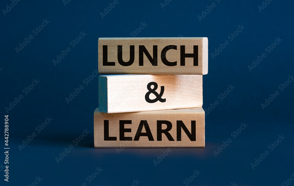 Naklejka premium Lunch and learn symbol. Wooden blocks with concept words Lunch and learn. Beautiful grey background, copy space. Business, educational and lunch and learn concept.